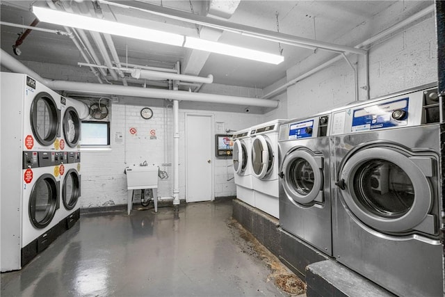 common laundry area with stacked washing maching and dryer and independent washer and dryer