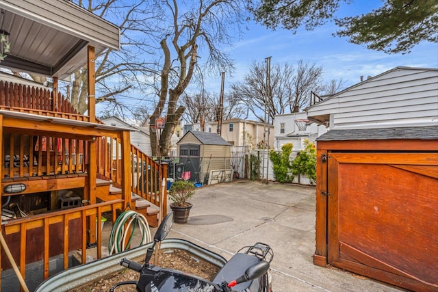 view of patio / terrace with a residential view and fence