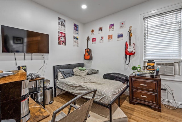 bedroom featuring light wood finished floors and recessed lighting