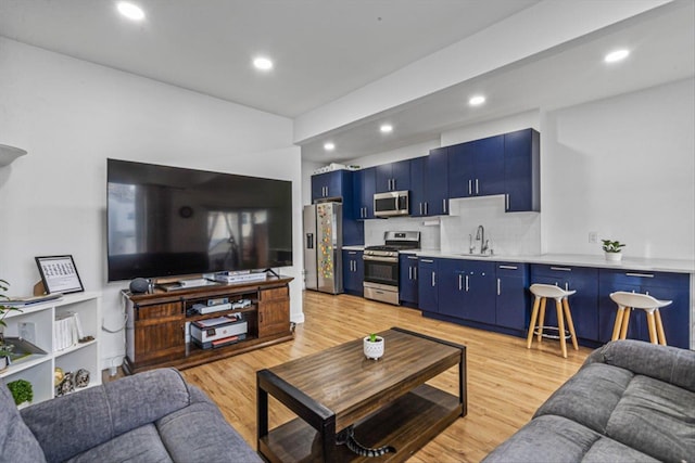 living room featuring light wood-style floors and recessed lighting