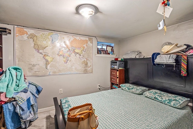 bedroom featuring baseboards