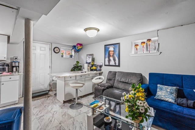 living area with marble finish floor