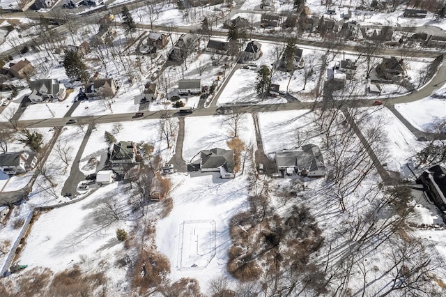 snowy aerial view featuring a residential view