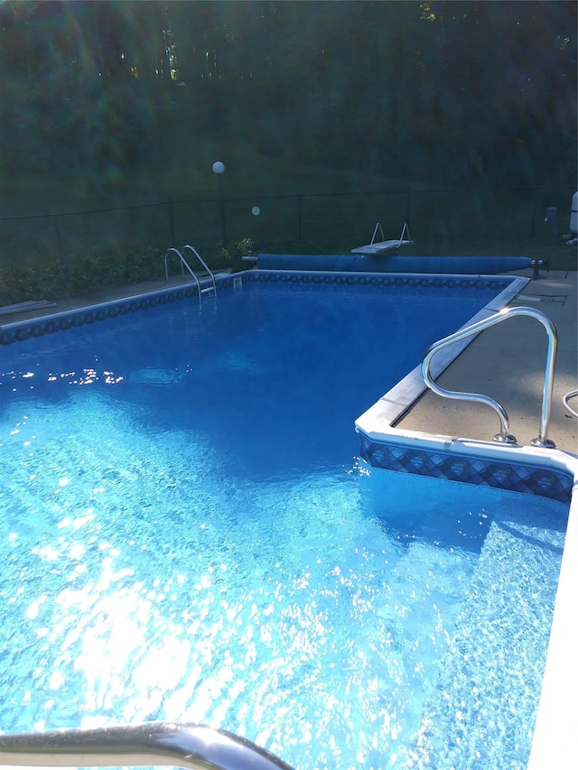 view of pool with fence and a fenced in pool