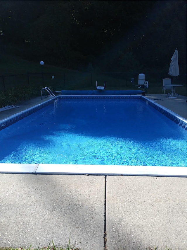 view of pool with fence and a fenced in pool