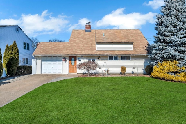 view of front of home featuring a garage, driveway, a chimney, and a front lawn