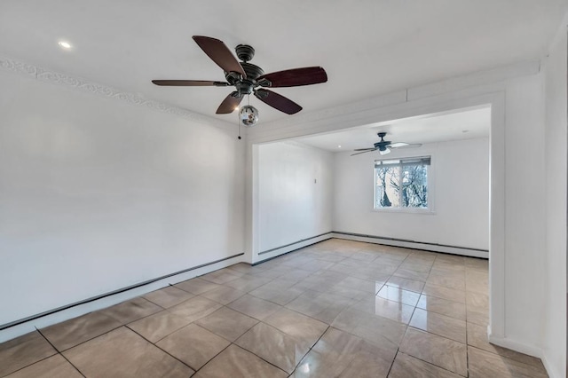 spare room with a baseboard radiator and light tile patterned floors