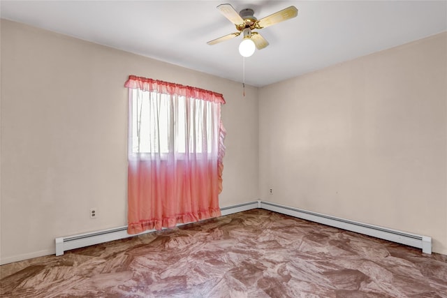 spare room with baseboard heating and a ceiling fan