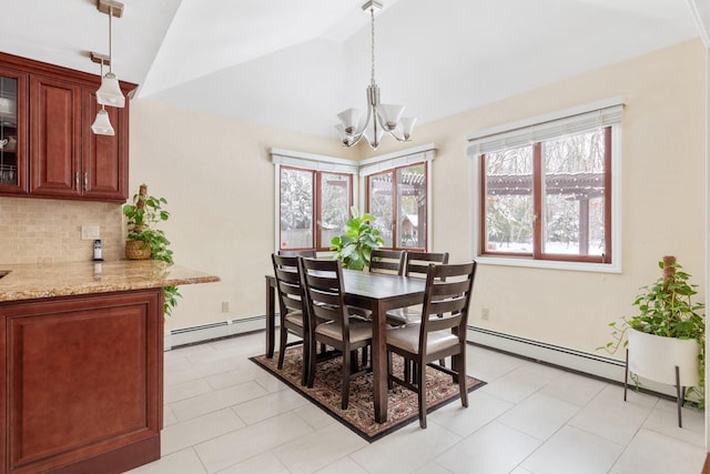 dining room with a baseboard radiator, a notable chandelier, and vaulted ceiling