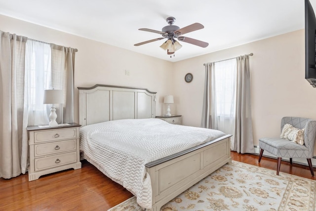 bedroom featuring light wood-style flooring and ceiling fan