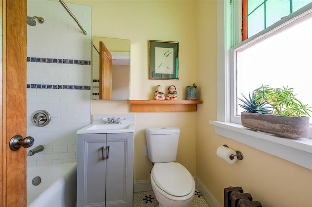 full bath featuring shower / washtub combination, vanity, toilet, and a healthy amount of sunlight