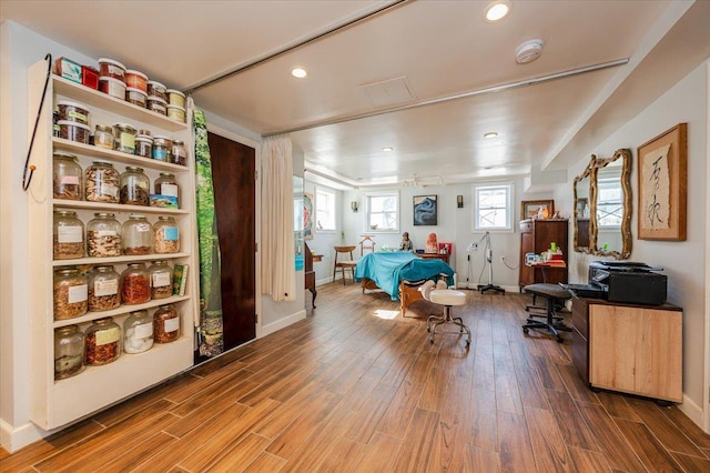 bedroom featuring recessed lighting, baseboards, and wood finished floors