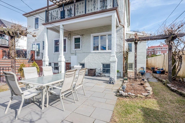 view of patio / terrace with outdoor dining space and fence