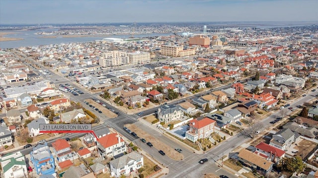 aerial view featuring a water view and a city view