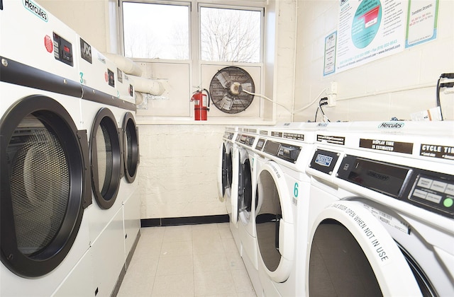 47-27 Little Neck Pkwy Unit L-2, Little Neck, NY 11362 - shared laundry area featuring a healthy amount of sunlight, light tile patterned flooring, and independent washer and dryer