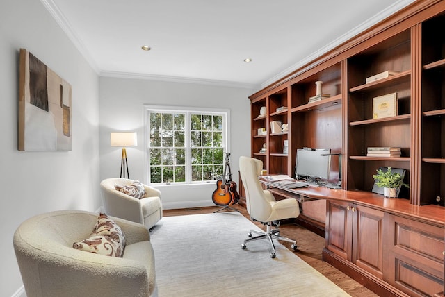 home office featuring light wood finished floors, baseboards, ornamental molding, and recessed lighting