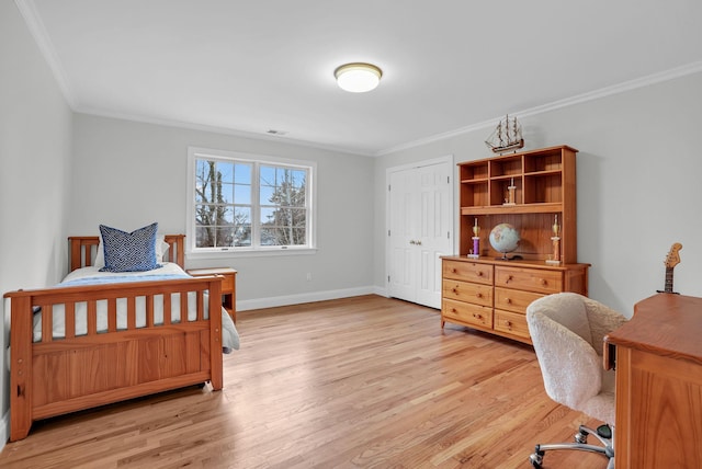 bedroom with light wood-type flooring, baseboards, and ornamental molding