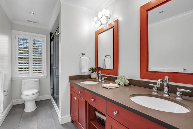 bathroom featuring ornamental molding, a sink, and visible vents