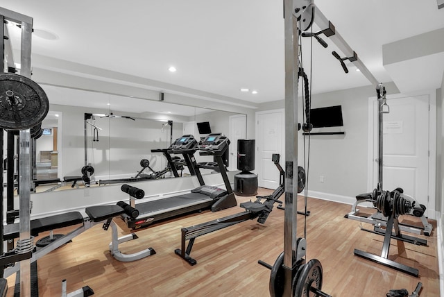 exercise room with recessed lighting, baseboards, and wood finished floors