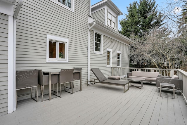 wooden terrace featuring an outdoor hangout area