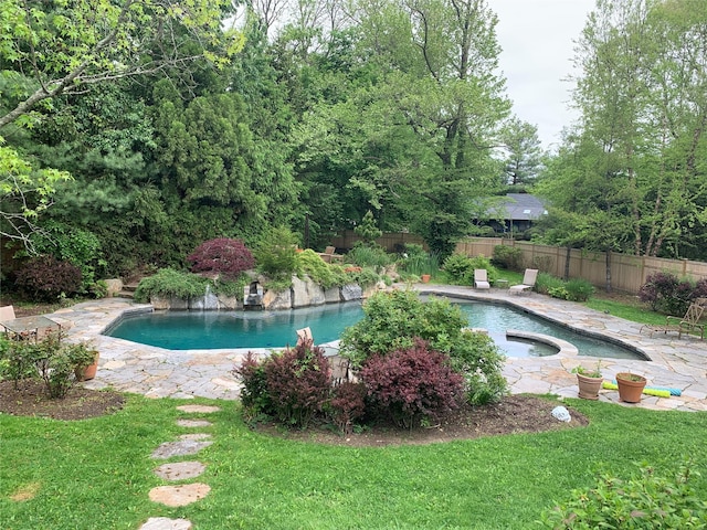 view of pool with a patio, a fenced in pool, an in ground hot tub, a yard, and a fenced backyard