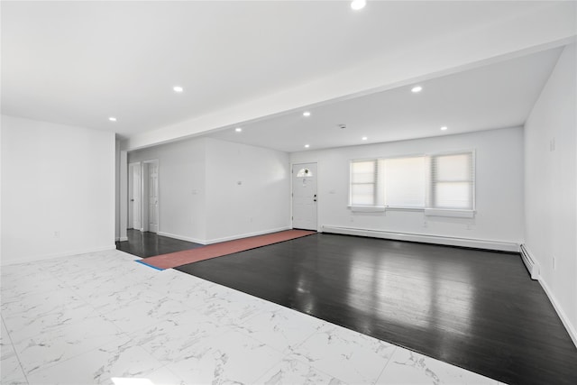 spare room featuring recessed lighting, marble finish floor, baseboard heating, and baseboards