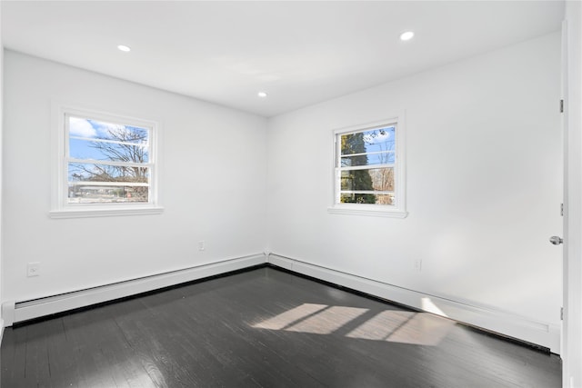 unfurnished room with wood finished floors and recessed lighting