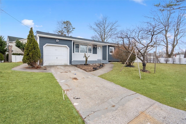 ranch-style house with a garage, driveway, fence, and a front yard