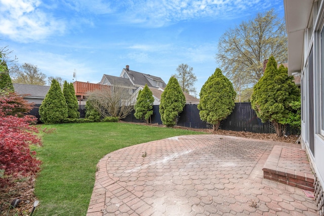 view of yard featuring a fenced backyard and a patio area