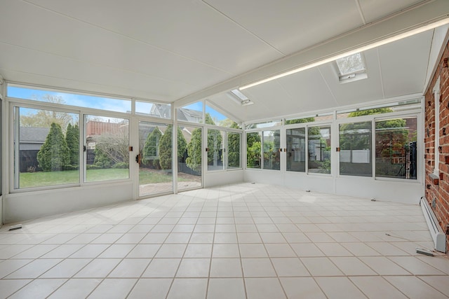 unfurnished sunroom featuring a skylight, a baseboard heating unit, and french doors