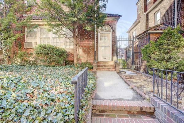 property entrance with brick siding