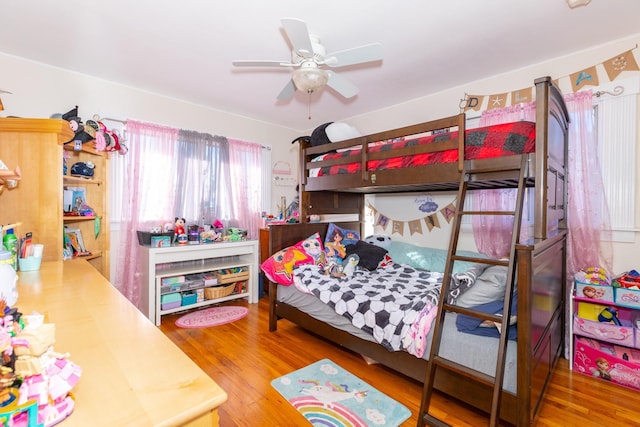 bedroom featuring ceiling fan and wood finished floors