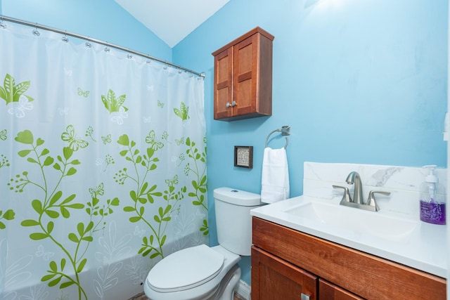 full bathroom featuring toilet, lofted ceiling, shower / bath combination with curtain, and vanity