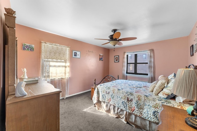 bedroom featuring carpet floors, a ceiling fan, and baseboards