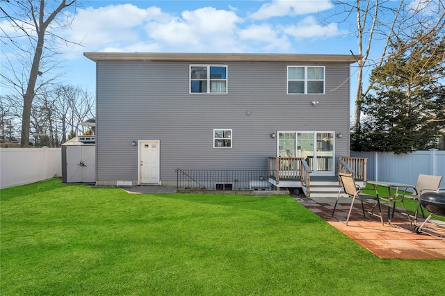 back of property with a patio area, a fenced backyard, and a yard