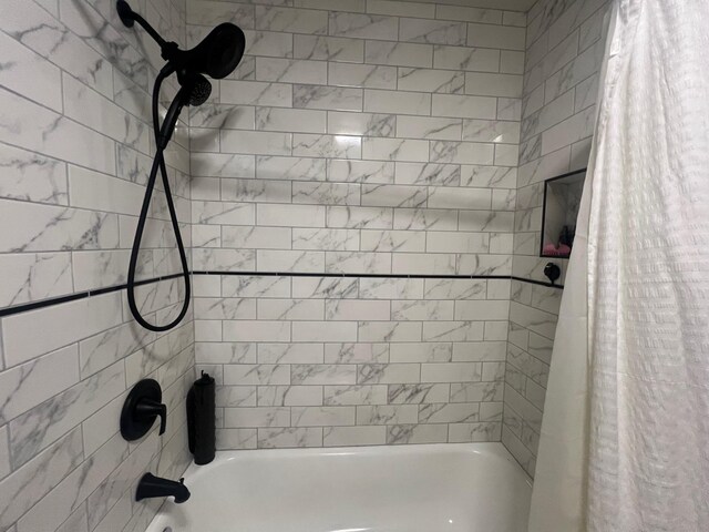 full bath featuring shower / tub combo with curtain