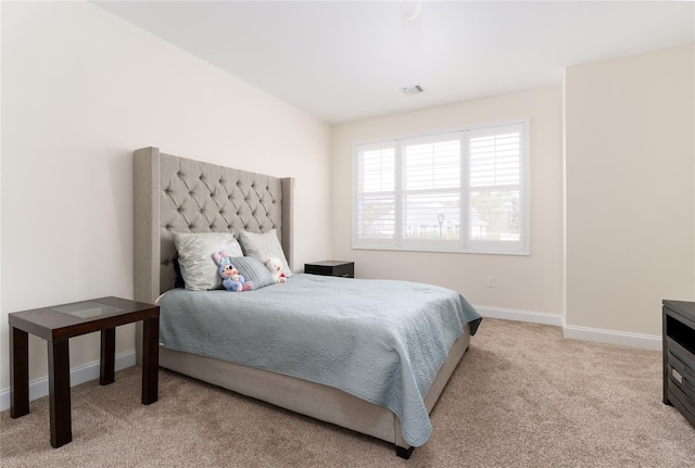 bedroom with carpet, visible vents, and baseboards