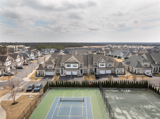 birds eye view of property with a residential view