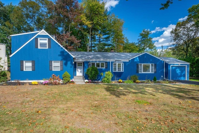 view of front facade with a garage and a front yard