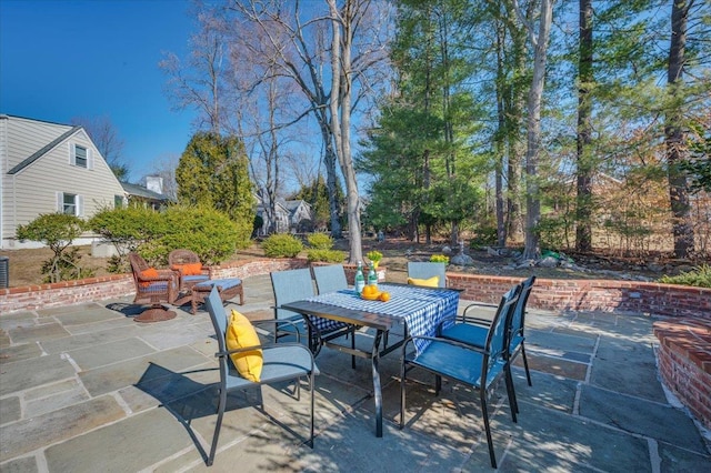 view of patio featuring outdoor dining area