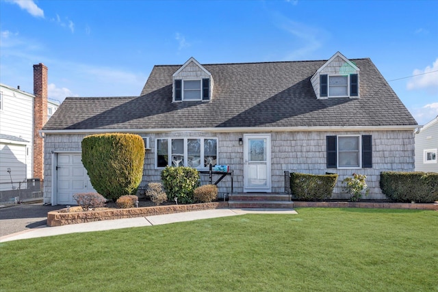 cape cod-style house featuring a garage, a shingled roof, driveway, and a front lawn