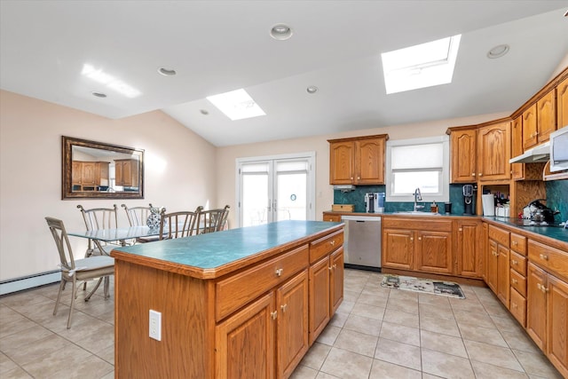 kitchen featuring brown cabinets, a kitchen island, stainless steel dishwasher, and light tile patterned floors