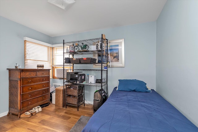 bedroom with wood finished floors