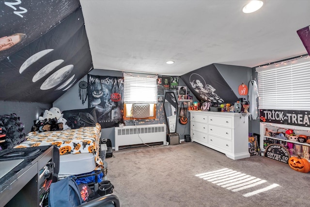 bedroom featuring carpet, vaulted ceiling, and radiator heating unit