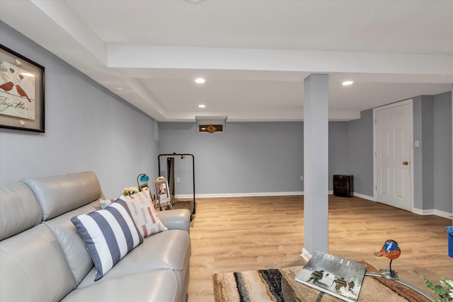 living area with recessed lighting, light wood-type flooring, and baseboards