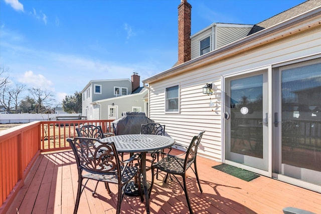 wooden deck with outdoor dining space