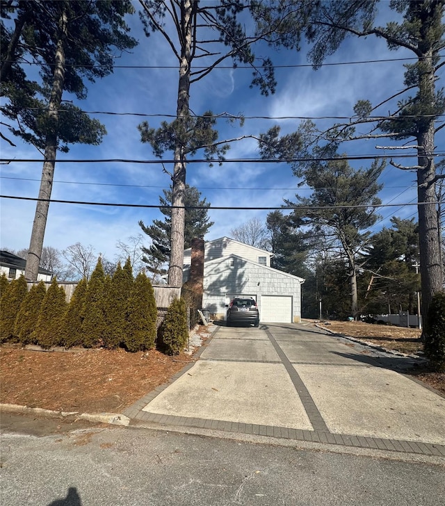 view of front of house featuring a garage and concrete driveway