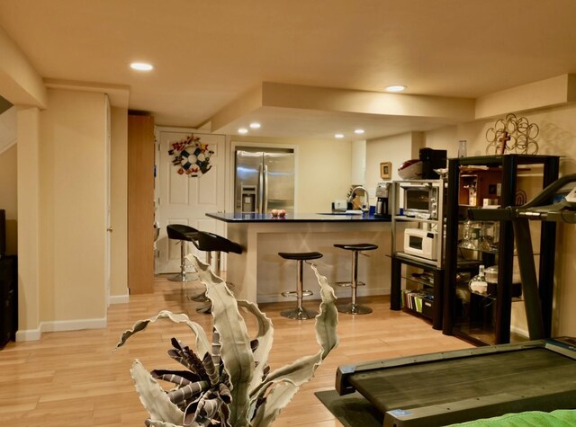 237 Berry Hill Rd, Syosset, NY 11791 - workout room with light wood-style flooring, baseboards, and recessed lighting
