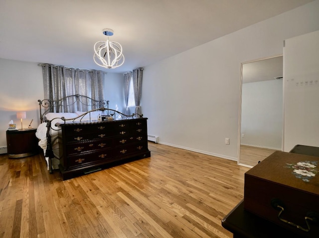 237 Berry Hill Rd, Syosset, NY 11791 - bedroom featuring a baseboard heating unit, light wood-style floors, a chandelier, and baseboards