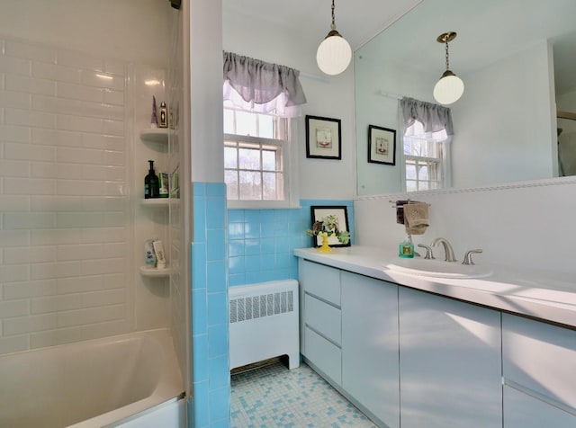 237 Berry Hill Rd, Syosset, NY 11791 - full bathroom with radiator heating unit, vanity, tile walls, and shower / washtub combination